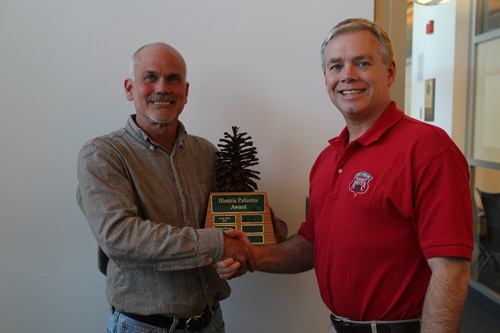Bill Pickens (left), NC Forest Service Conifer Silviculturalist, receives the Illustris Palustris Award from NC Longleaf Coalition